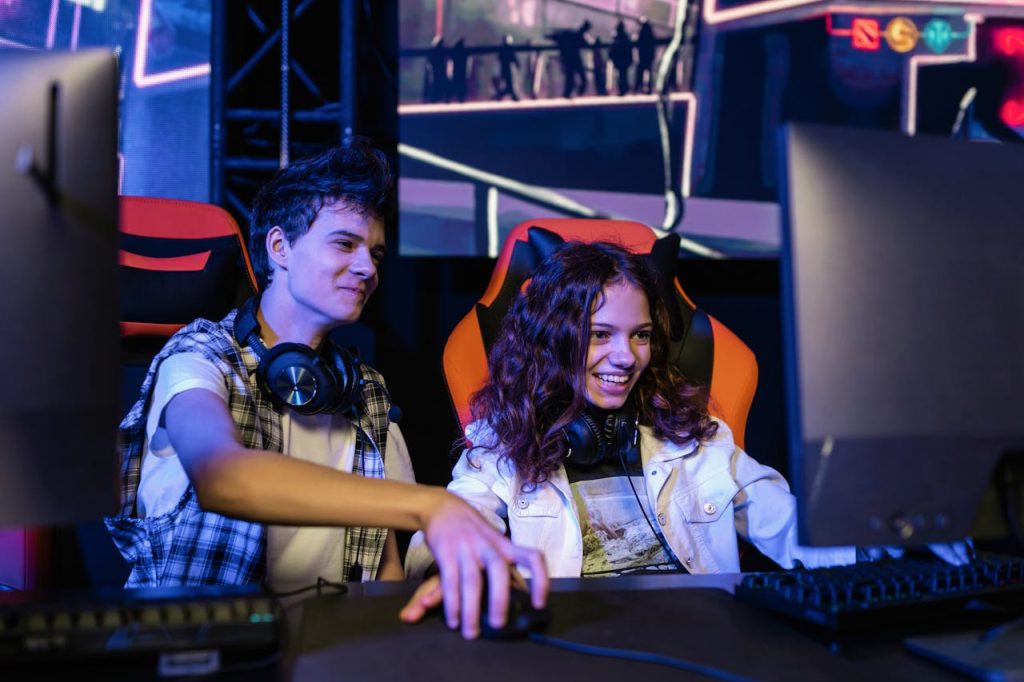 Teenagers playing a multiplayer video game indoors, enjoying teamwork and strategy.